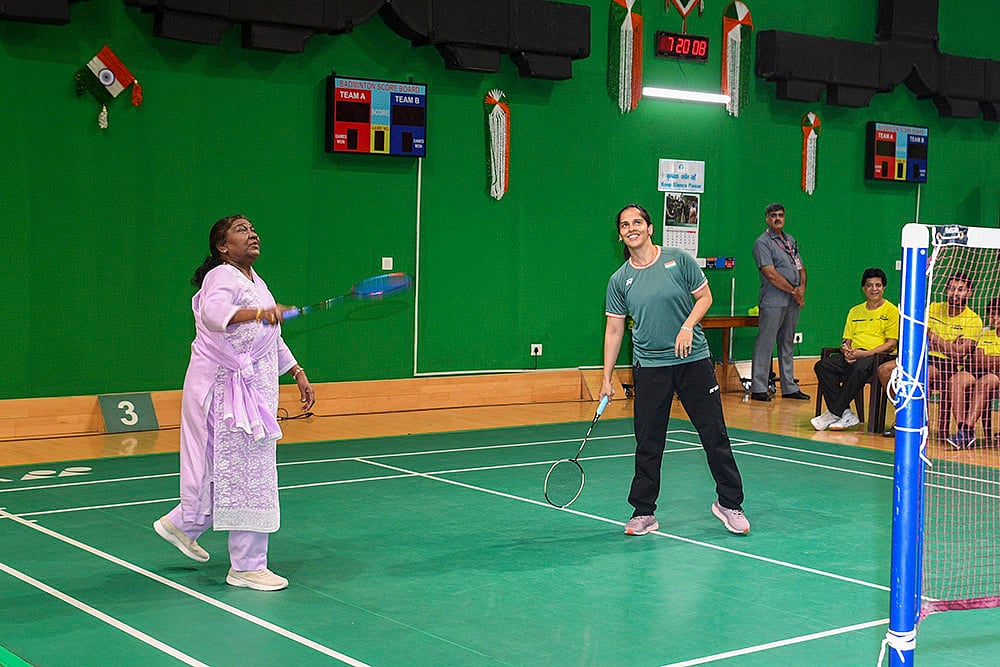 | Photo: PTI  : Prez Droupadi Murmu plays badminton with Saina Nehwal 